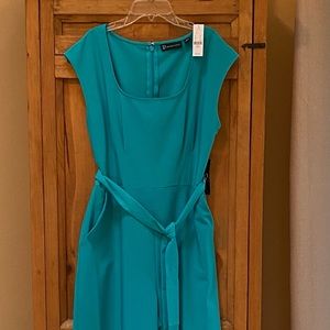 Turquoise one piece wide leg cropped pantsuit. New